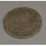 A Mexican silver Pillar Dollar 8 Reales 1736 coin.