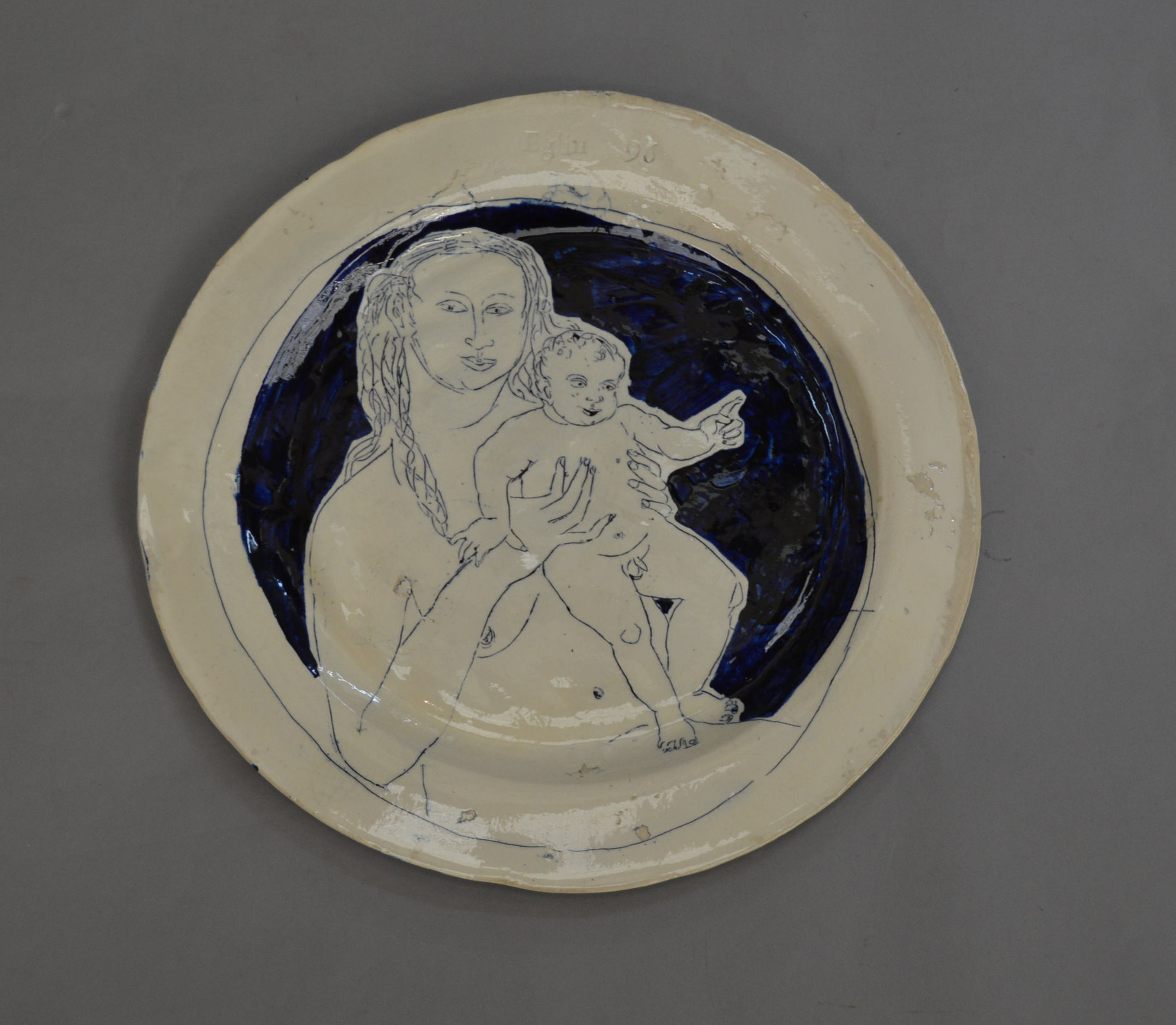 A large ceramic plate by Philip Elgin dated 96. 39cm diameter.