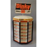 An unboxed empty Dinky Toys revolving counter display stand with internal light,