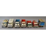 A group of unboxed Tri-ang Pressed Steel toys including four trucks from the 'Jumior' series,
