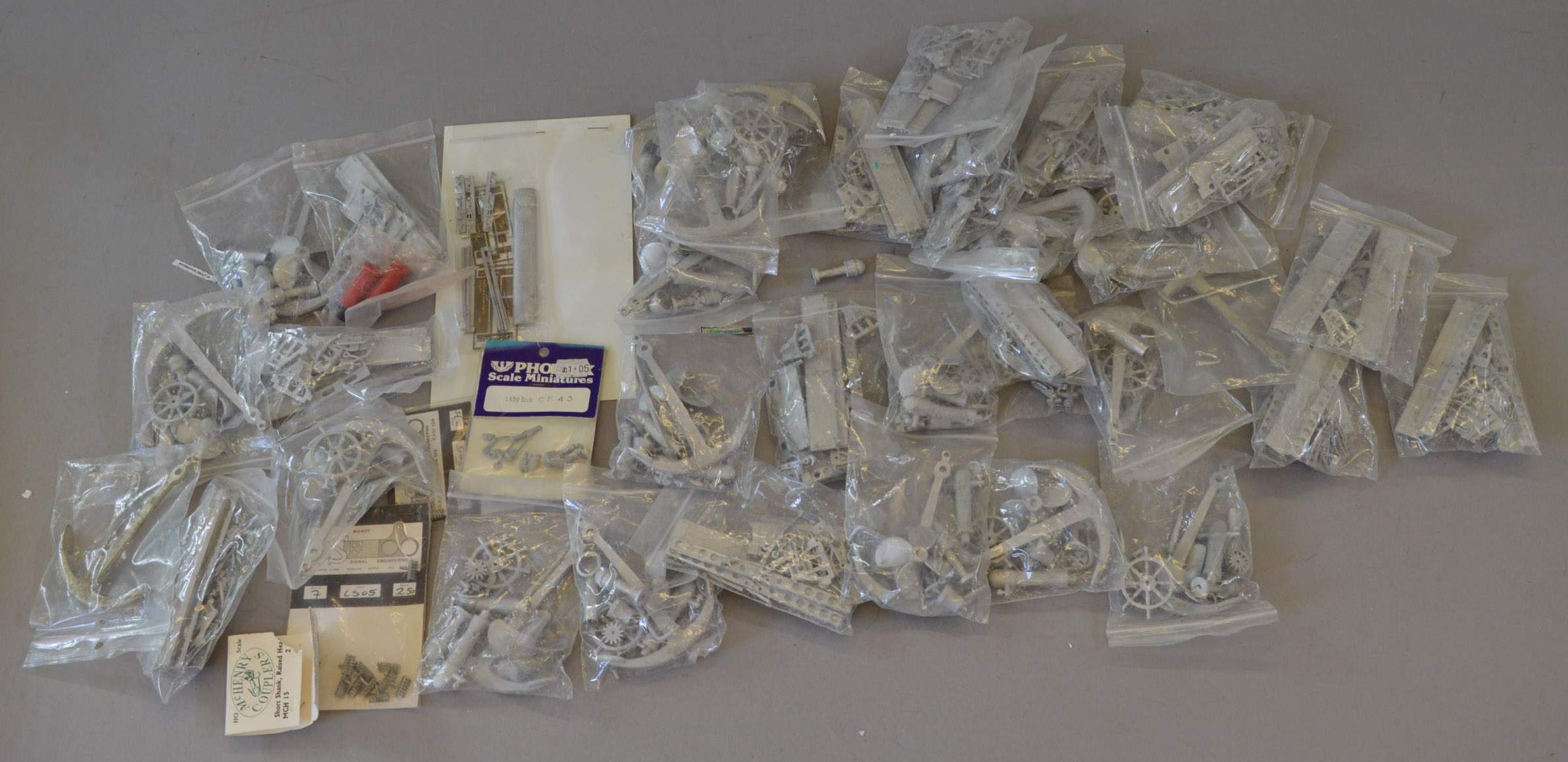 A good quantity of assorted white metal model railway parts and accessories.