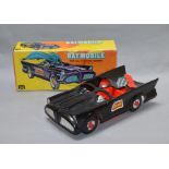 A boxed plastic free-wheel 'Batmobile', made in Hong Kong for Mego Corporation (N.Y.