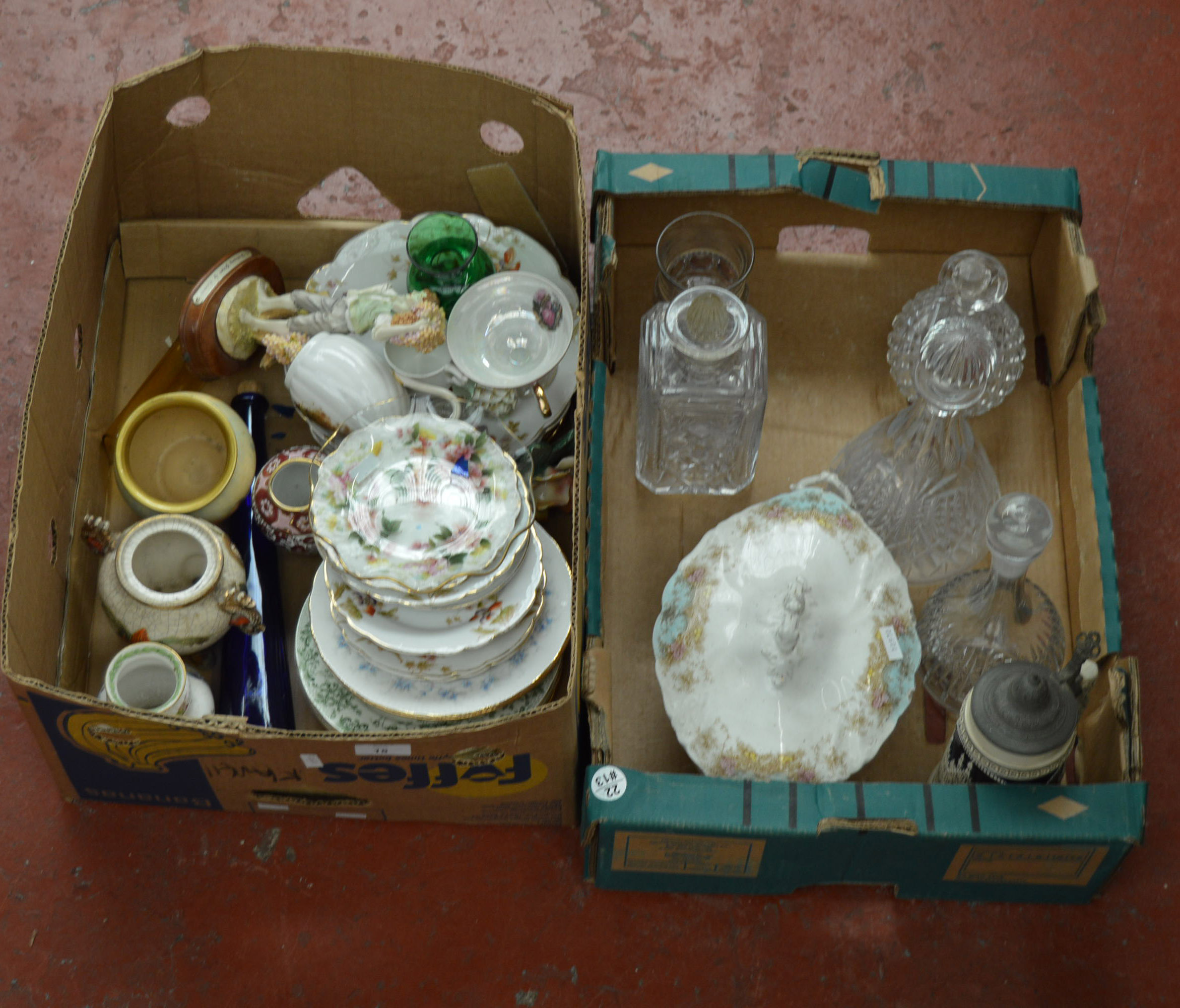 Two boxes of assorted ceramics and glassware.