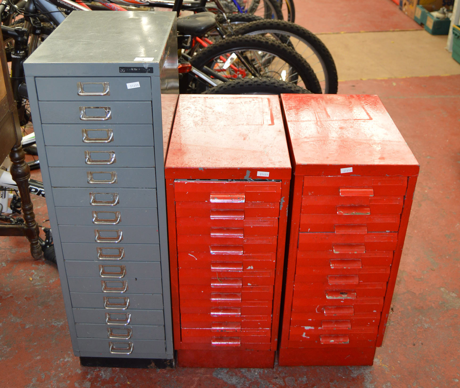 3 metal filing cabinets - one contains assorted tools.