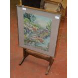 A glass fronted fire screen/ folding side table.