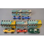 Five Scalextric slot cars: C82 Lotus in blue; C67 Lotus in red with racing number 1;