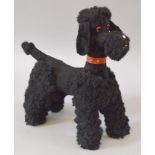 A soft toy Black Poodle (Circa 1920's) with studded collar and glass eyes,