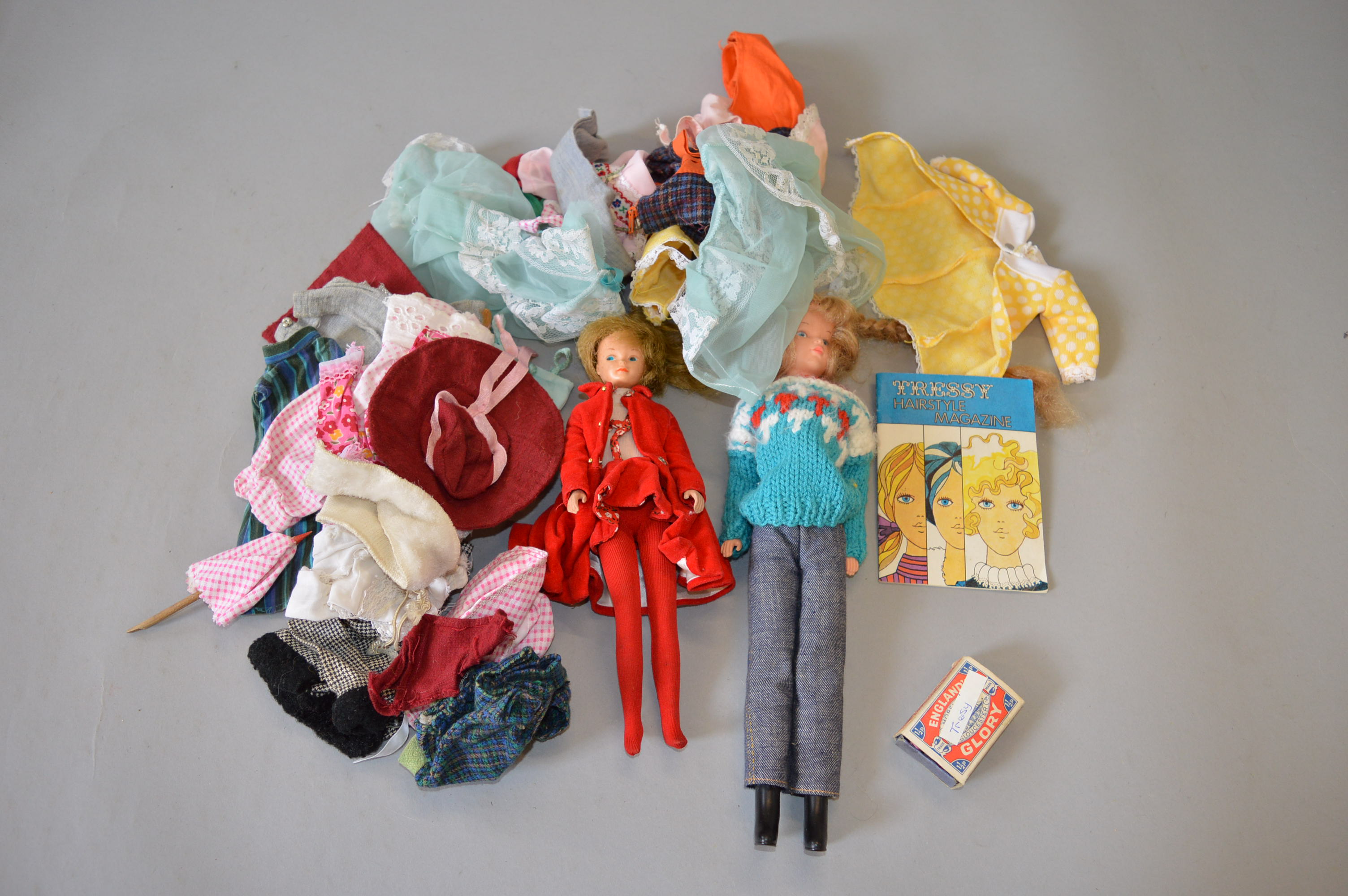 An unboxed Palitoy 'Tressy' doll together with another unboxed doll and a quantity of clothing and