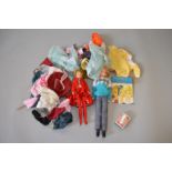 An unboxed Palitoy 'Tressy' doll together with another unboxed doll and a quantity of clothing and