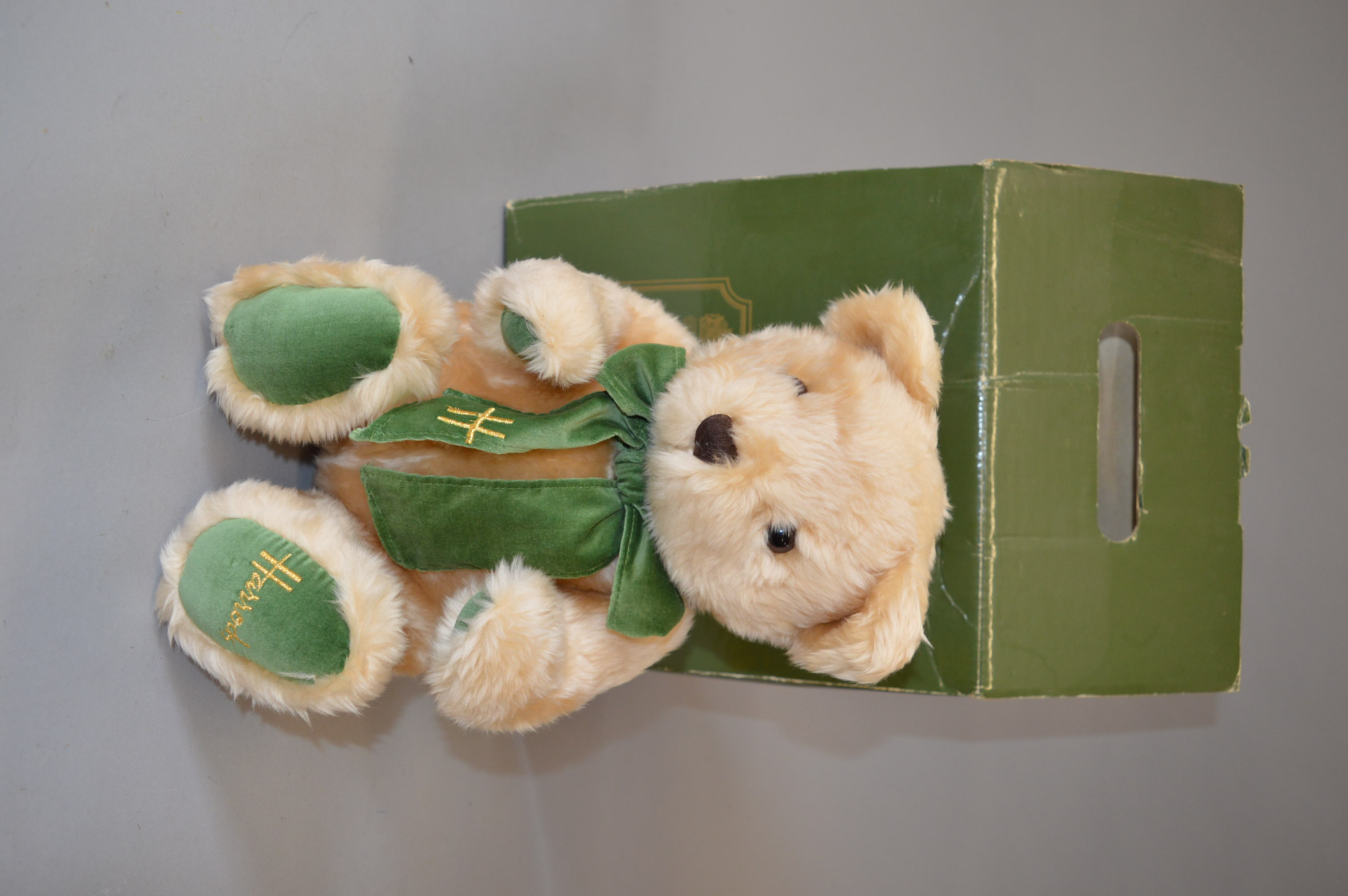 A boxed 'Harrods' Bear, c 1995,with 'Harrods Ten Teddies Anniversary' tag, appears VG.