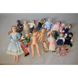 Good quantity of assorted dolls: two cloth dolls with moulded faces and stitched features; wax doll;