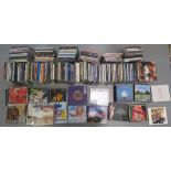 a collection of CDs including pink Floyd - the wall, Piper at the Gates of Dawn- mono ,