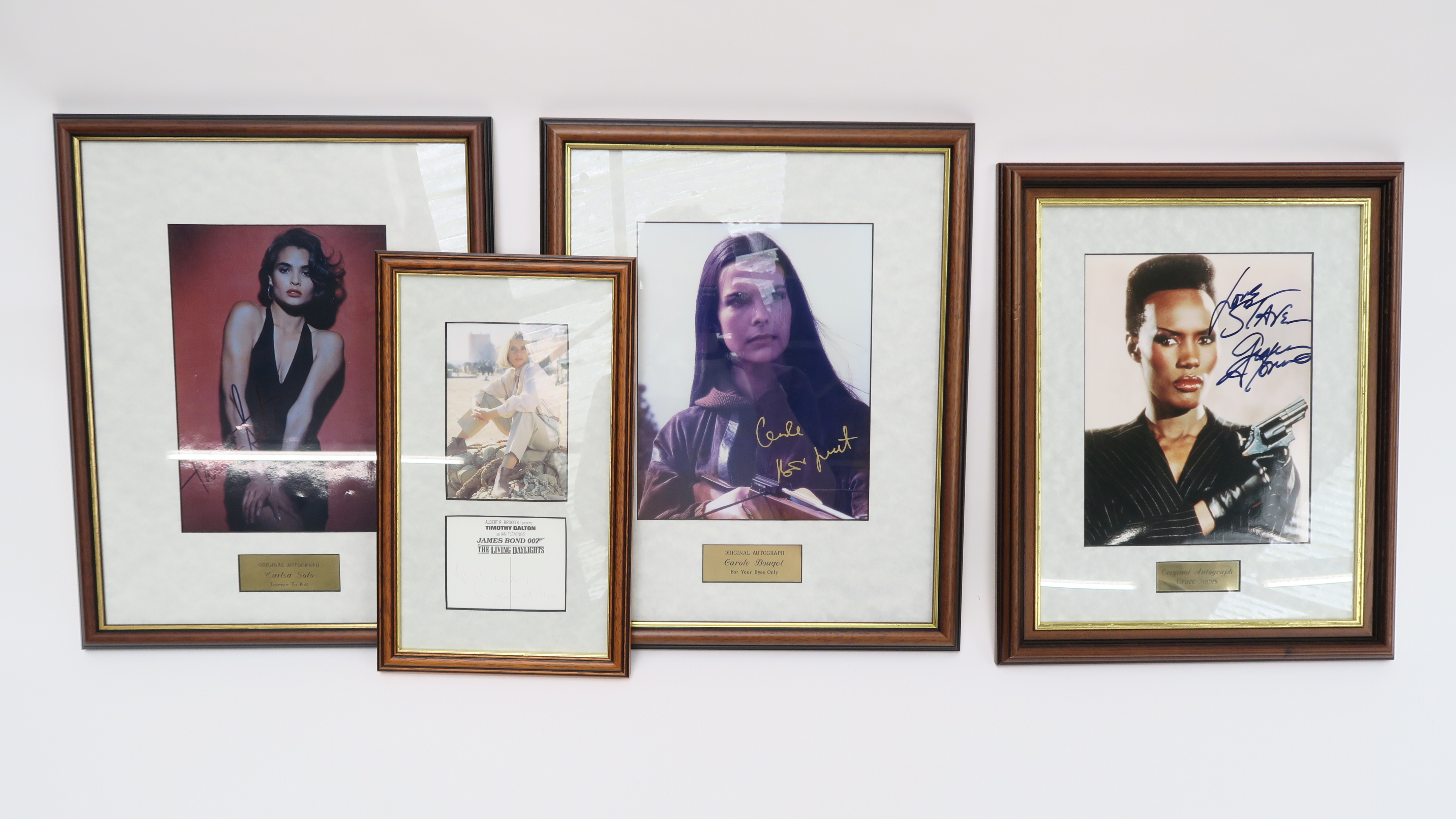 Four Bond girl signatures including Tialsa Solo (Licence to Kill) signed on photo with COA,