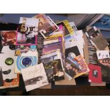3 boxes full of 7" vinyl singles, some with sleeves, many in cardboard outers,