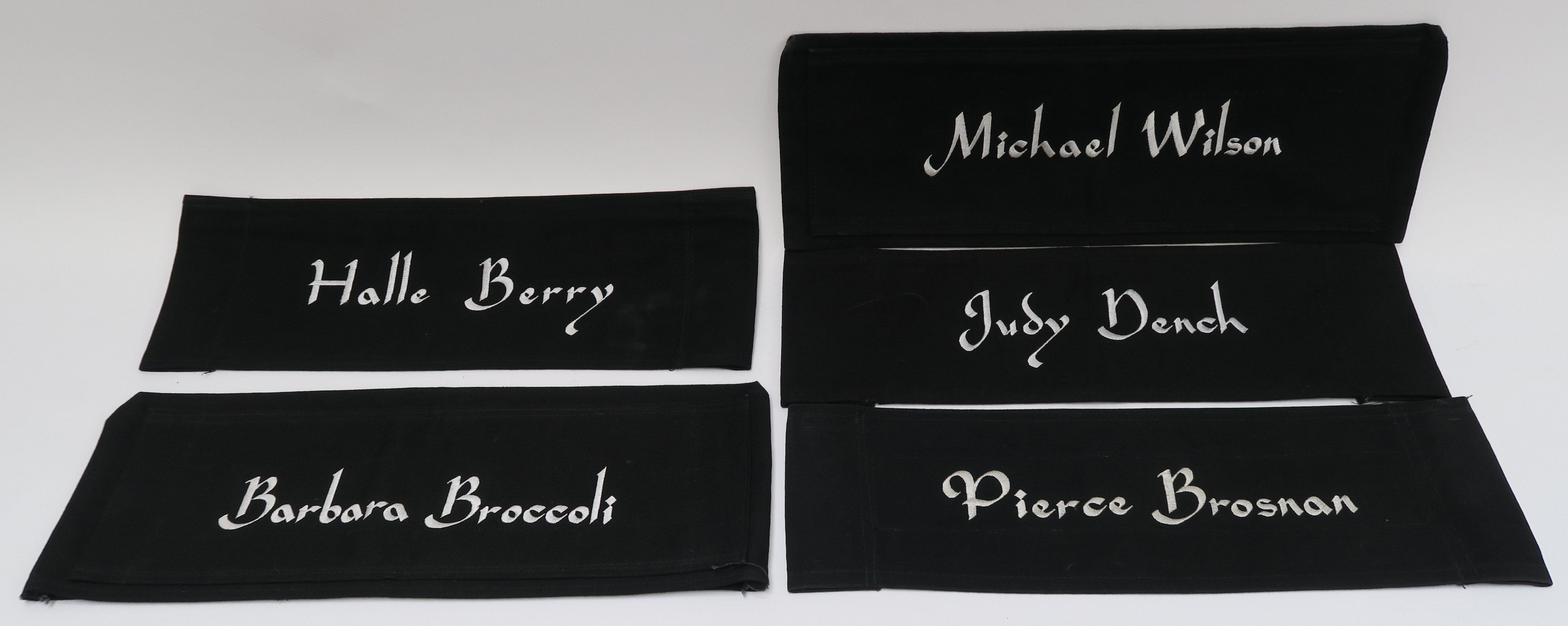 James Bond Directors chair canvas backs with embroidered names including Pierce Brosnan,