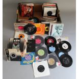 Large collection of 7" singles in box including Madonna, The Specials, The Who, David Bowie,