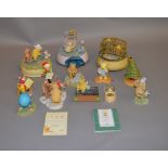 13 Winnie-The-Pooh figures including Royal Doulton and Border Fine Arts examples, all boxed.