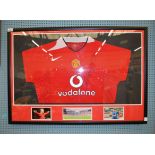 A framed Manchester United FC squad home shirt signed by Wayne Rooney, probably 2004-06.