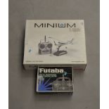 MINIUM Cessna 210 Centurion model aircraft together with a Futaba controller