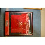 A framed Manchester United FC squad home shirt signed by the Manchester United Squad,