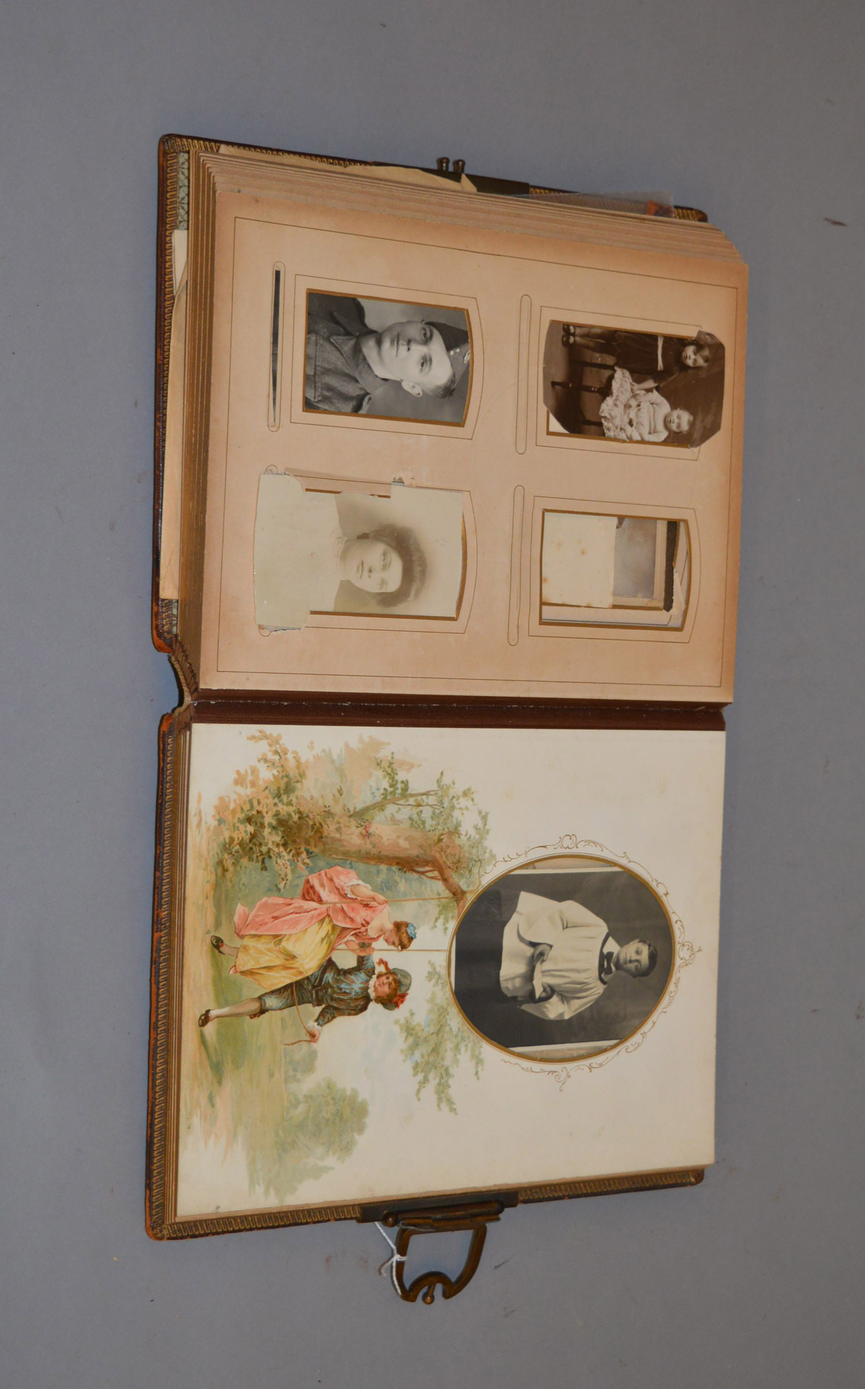 A late 19th/ early 20th century photograph album containing various family photographs etc.