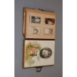 A late 19th/ early 20th century photograph album containing various family photographs etc.