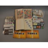 A collection of presentation packs and stamps etc