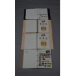 4 stamp albums containing mostly commonwealth stamps.