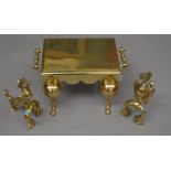 A 19th century brass gilt lacquered foot stool together with a pair of fire dogs (3)