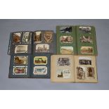 4 early 20th century postcard albums containing a good selection of cards, various themes.