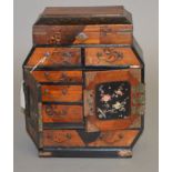A late 19th/ early 20th century Japanese spice or jewellery cabinet with mother of pearl door