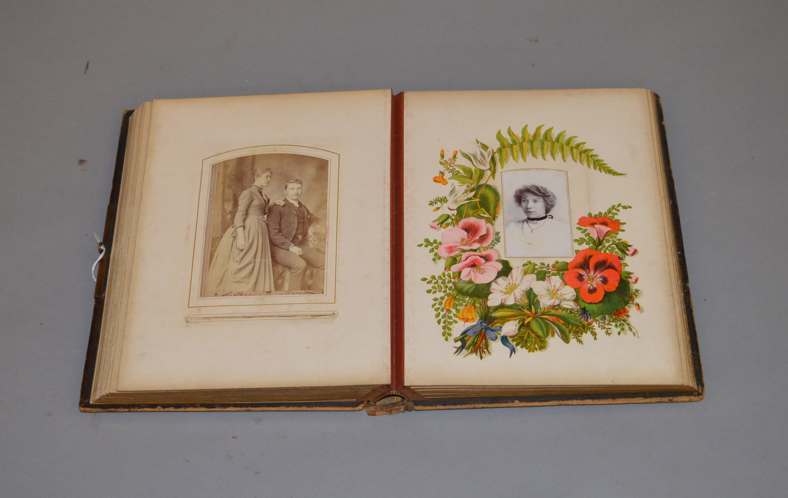 A Victorian photograph album containing various portrait photographs.