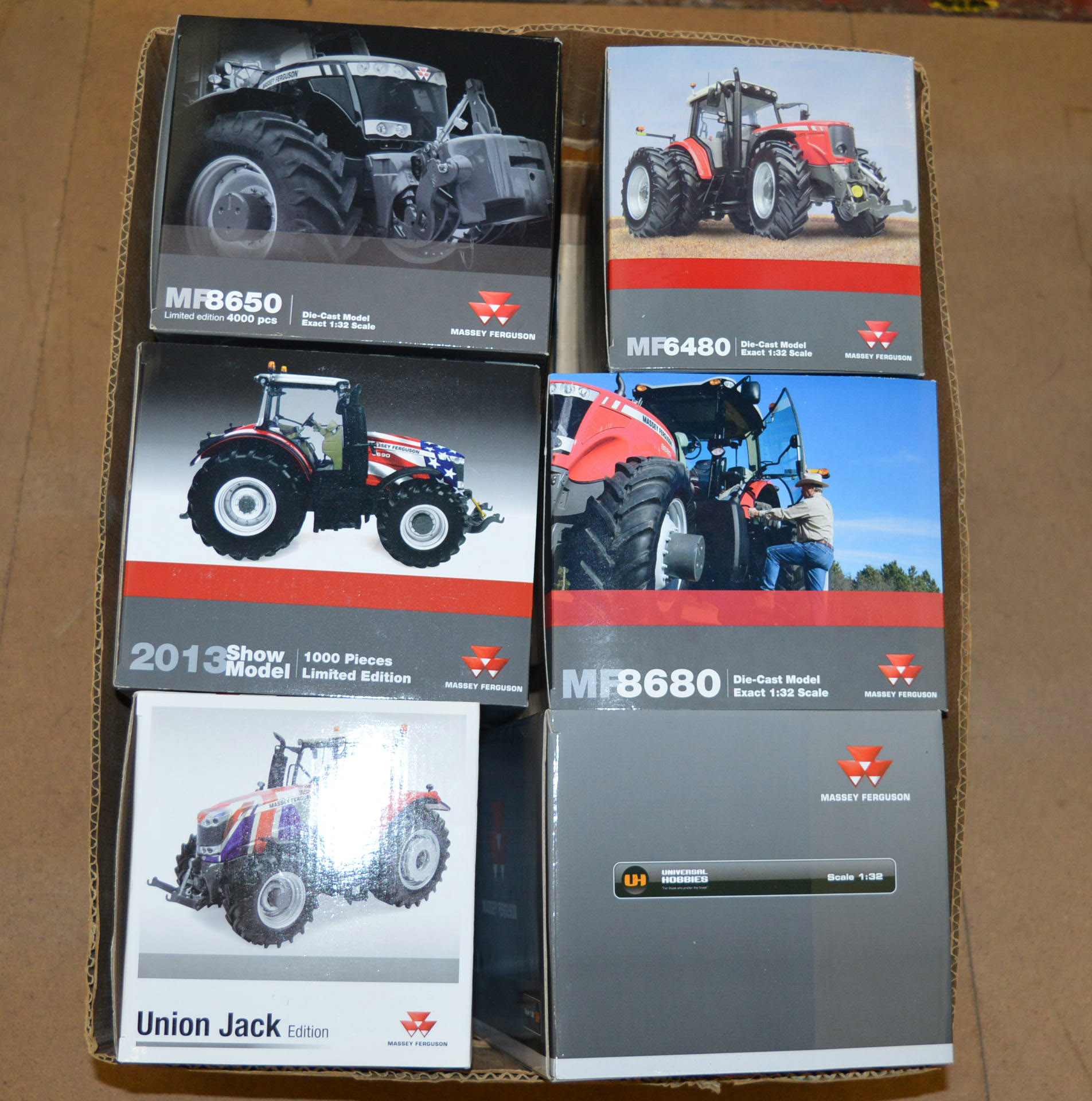 Six Universal Hobbies 1:32 scale diecast model tractors,