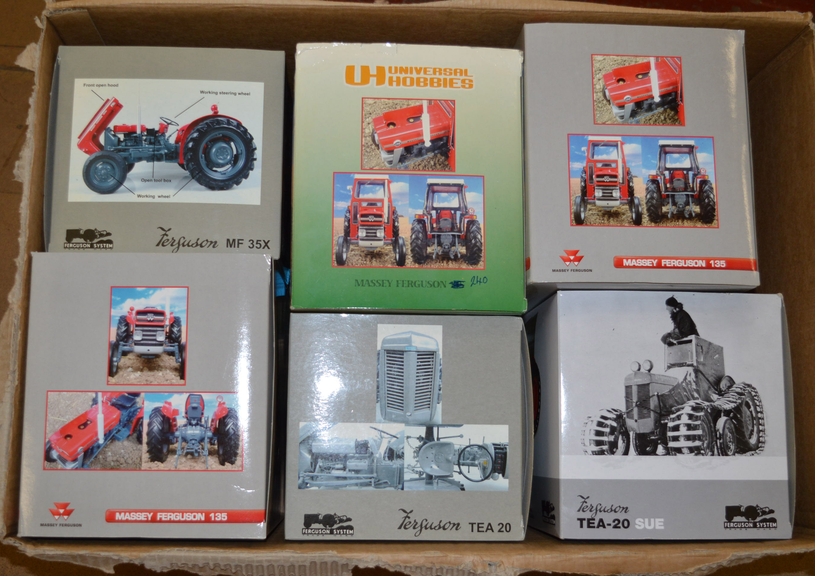 Six Universal Hobbies 1:16 scale Massey Ferguson diecast model tractors.