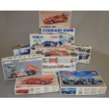 11 x plastic model kits, all cars, by Tamiya, Academy Minicraft and others. Contents not checked.