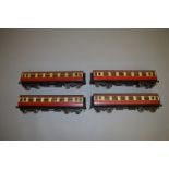 O gauge. Four Bassett-Lowke coaches in red and cream. A/F.