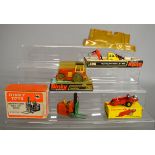 Four Dinky Toys diecast models, 14c, 321 Manure Spreader, late issue with yellow plastic hubs,