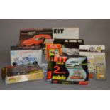 Eight metal model kits, all cars, by Solido, IMC and others. Contents not checked.