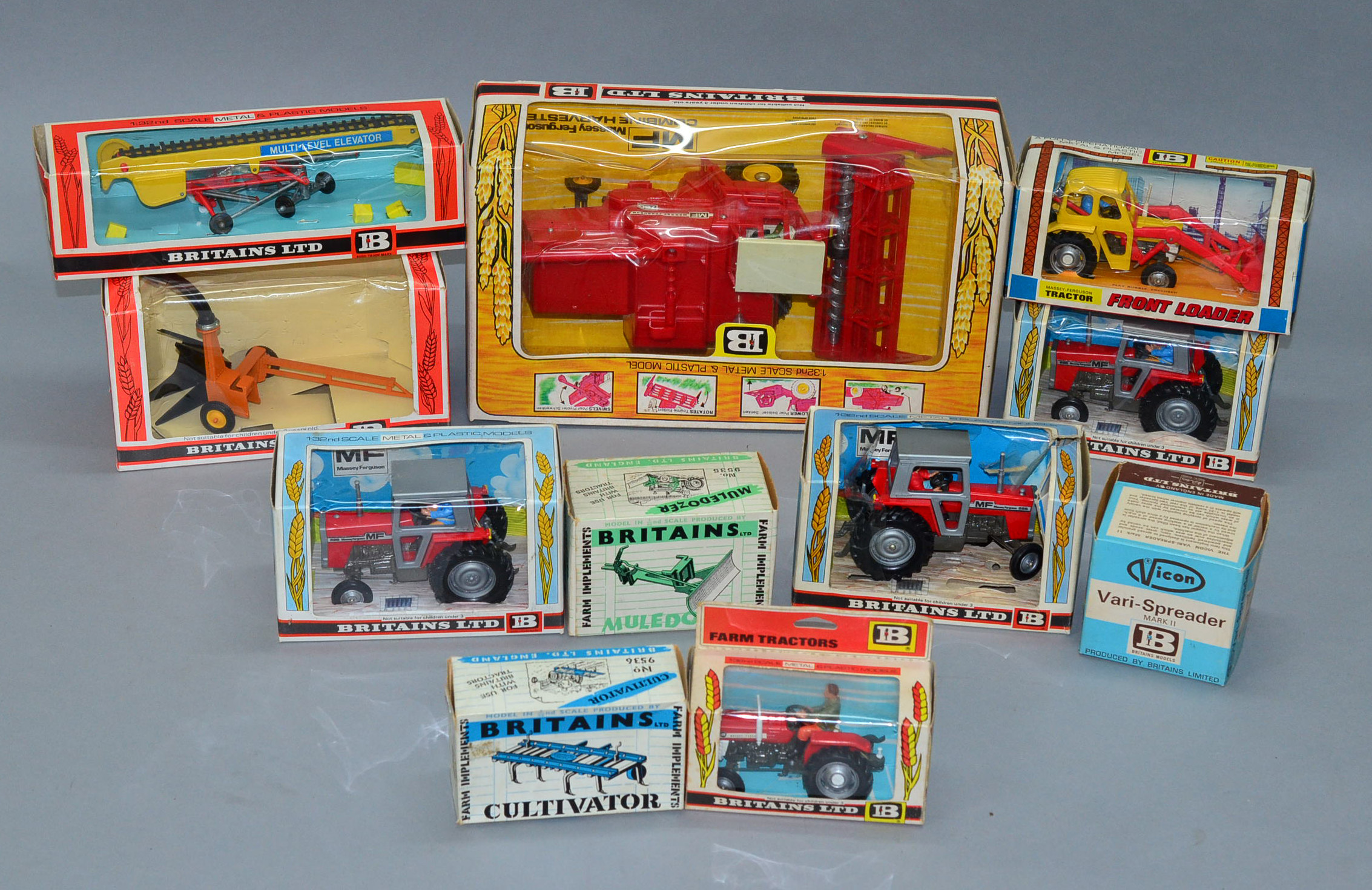 A good quantity of vintage boxed Britains agricultural vehicles and farm implements including a