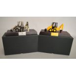 Two boxed JCB ICX Skid Steer diecast models in 1:32 scale, by RC ERTL,
