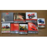 Eight boxed Universal Hobbies diecast model Massey Ferguson Tractors in 1:16 and 1:32 scale.
