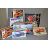 Nine plastic model kits, all cars, by Academy Minicraft, Airfix and similar.