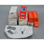 Nine boxed white metal and resin model car kits in 1:43 scale,