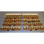 O gauge. 10 x coach bodies, tin and wooden, in cream and brown. No windows/bogies/wheels. VG.