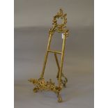 A small brass easel, early 20th century. 53cm tall.