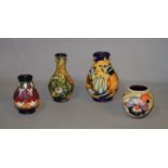 Four 21st century Moorcroft vases, various shapes and designs (2 with boxes). Tallest 14cm.