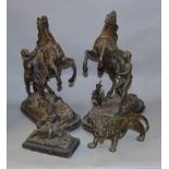 A pair of spelter horse and rider figures together with a similar lion and other marble set figure