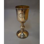 POLICE > A William IV silver religious chalice with gilded interior,