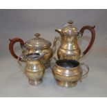 A silver four piece tea set with Celtic decoration & composition handles,