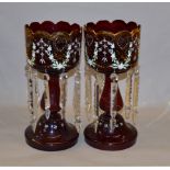 A pair of Victorian era ruby glass lustres with gilding and enamel design,